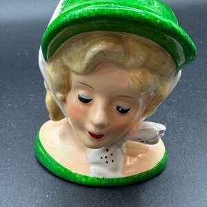 Vtg lady head vase blonde lady green dress, green hat and wht hat tie
